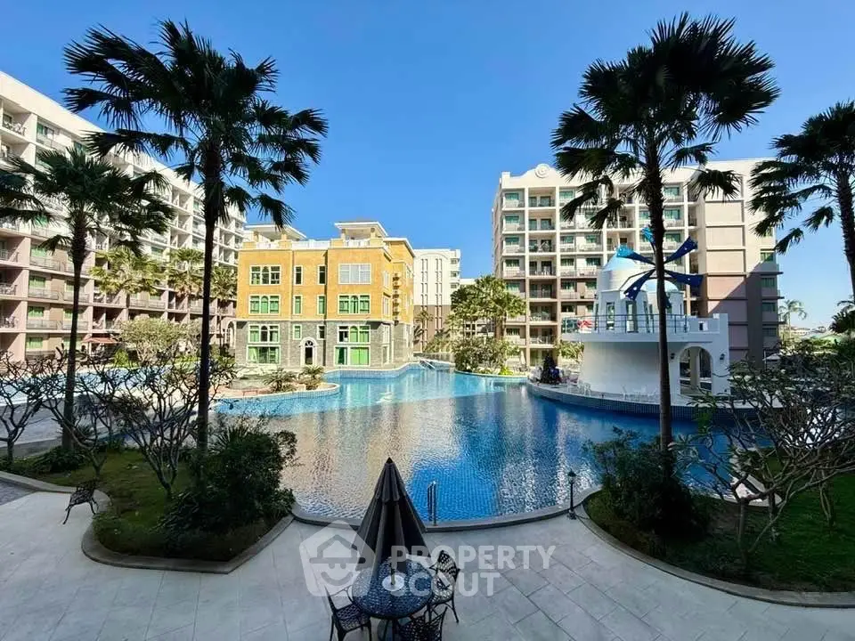 Luxurious residential complex with stunning pool and palm trees