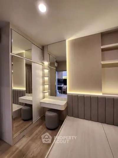 Modern bedroom with mirrored wardrobe and stylish lighting