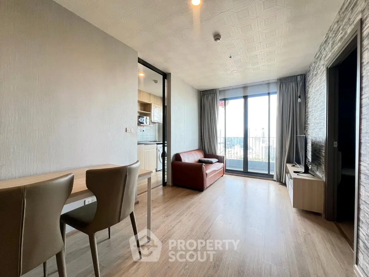 Modern living room with balcony view and stylish furniture