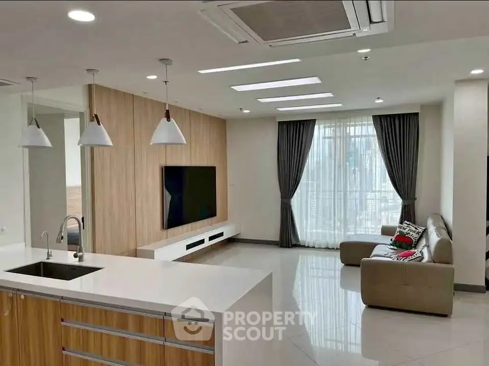 Spacious modern living room with open kitchen and stylish decor