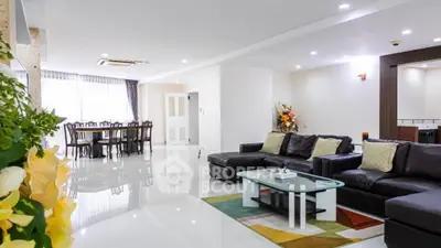 Spacious modern living room with elegant dining area and stylish decor