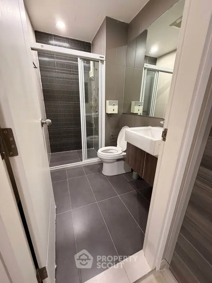 Modern bathroom with sleek design and glass shower enclosure