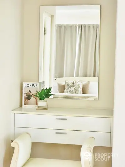 Elegant bedroom vanity with mirror and stylish decor in modern home