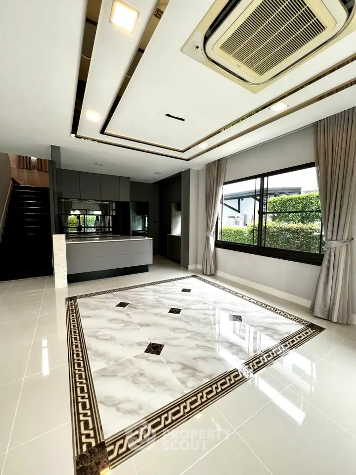 Luxurious modern living room with elegant marble flooring and large windows offering garden views.