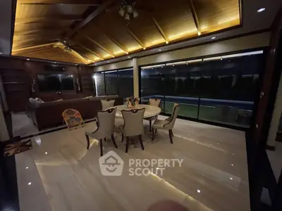 Luxurious living room with elegant dining set and ambient lighting