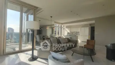 Luxurious living room with panoramic city view and modern open kitchen