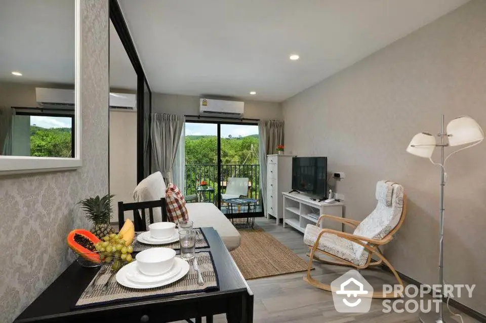 Modern living room with balcony view and stylish furniture in a cozy apartment.