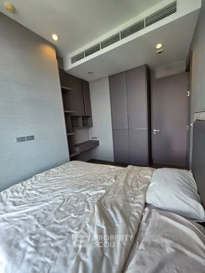 Modern bedroom with sleek built-in storage and minimalist design