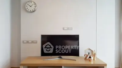 Modern living room with sleek TV and minimalist decor