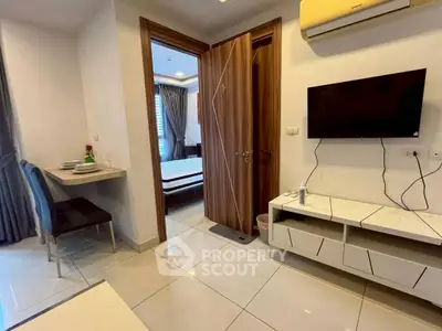 Modern apartment interior with sleek furniture and open layout, featuring a cozy bedroom and stylish living area.