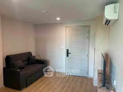 Modern living room with sleek furniture and air conditioning in a cozy apartment.