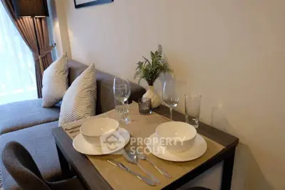 Cozy living room with elegant dining setup and natural light