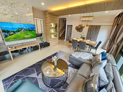 Luxurious modern living room with stylish decor and open dining area, perfect for entertaining.