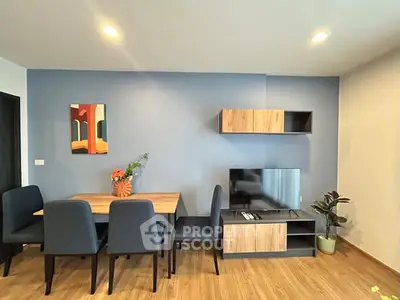 Modern living room with stylish furniture and wall art, perfect for cozy gatherings.