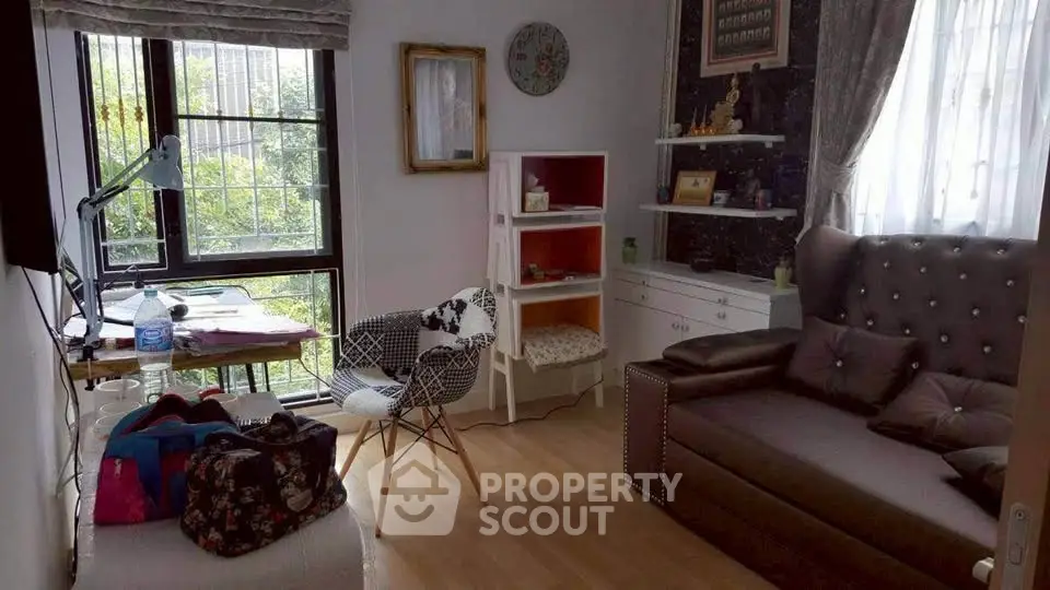 Charming living room with cozy seating and natural light
