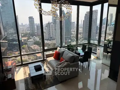 Luxurious high-rise living room with stunning cityscape views and modern furnishings.