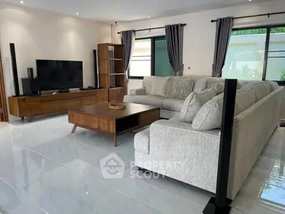 Spacious modern living room with elegant furniture and natural light