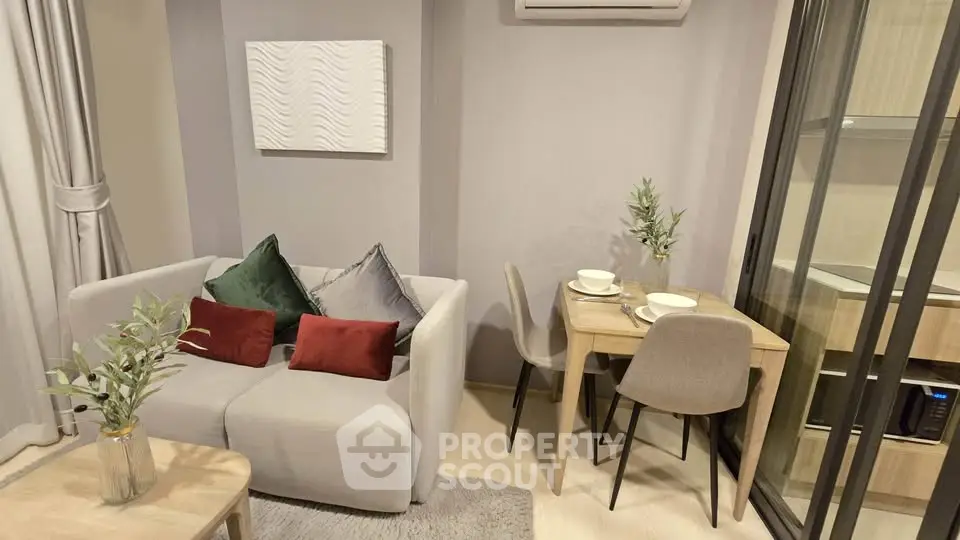 Modern living room with cozy sofa and dining area in stylish apartment