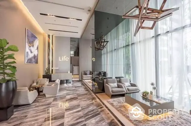 Luxurious modern lobby with elegant seating and marble flooring in high-end building