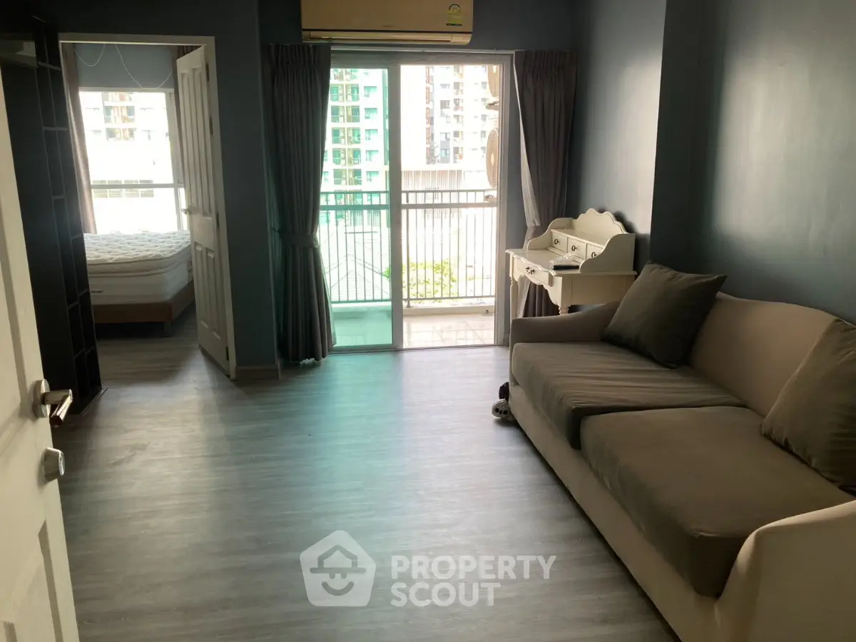 Spacious living room with balcony access in modern apartment