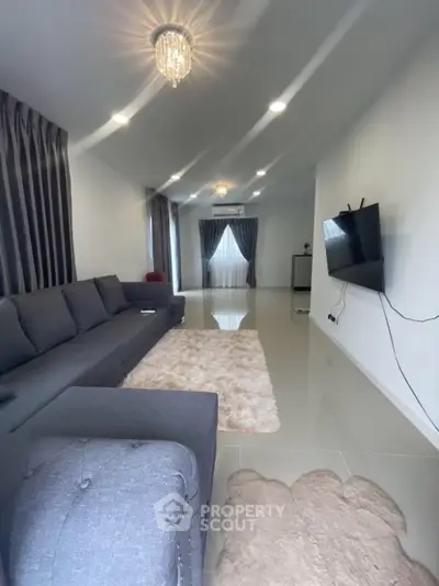 Spacious modern living room with elegant decor and plush seating