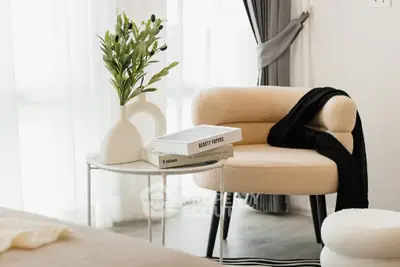 Stylish modern living room with cozy armchair and elegant decor