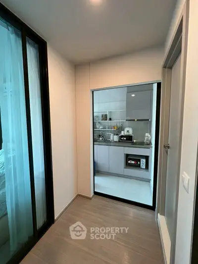 Modern compact kitchen with sleek appliances and open layout