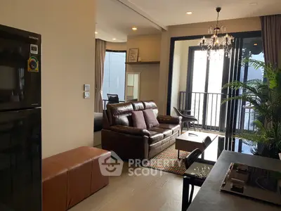 Modern living room with elegant decor and balcony view in a stylish apartment