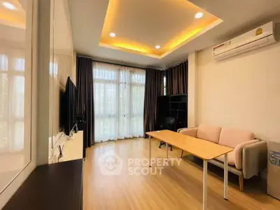 Modern living room with stylish ceiling lights and large windows