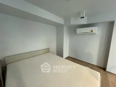 Minimalist bedroom with air conditioning and modern design