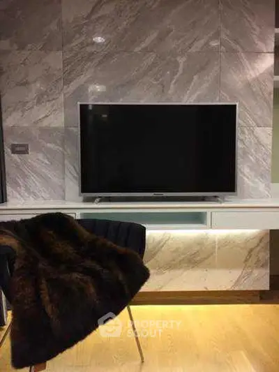 Modern living room with sleek TV setup and luxurious decor