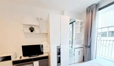 Modern apartment interior with sleek furniture and large window view