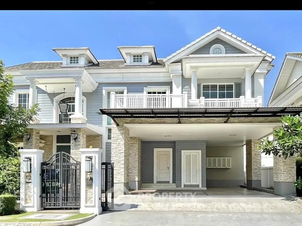 Stunning two-story house with elegant facade and spacious driveway in a serene neighborhood.