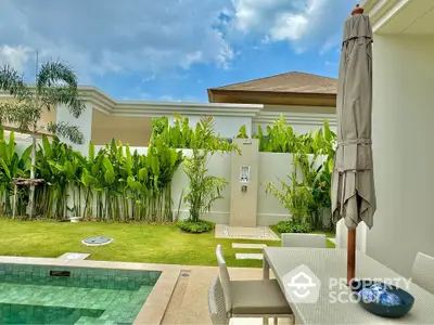 Luxurious villa with private pool and lush garden, perfect for relaxation and entertaining.