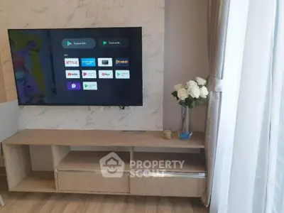 Modern living room with smart TV and elegant wooden cabinet