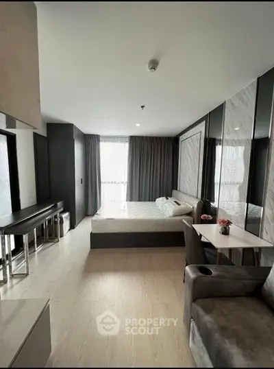 Modern bedroom with stylish decor and natural light