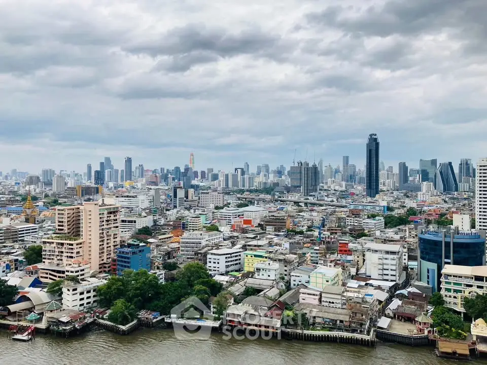 Stunning cityscape view showcasing a vibrant urban skyline with diverse architecture and a river in the foreground.