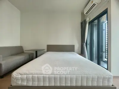 Modern bedroom with minimalist design and large window for natural light