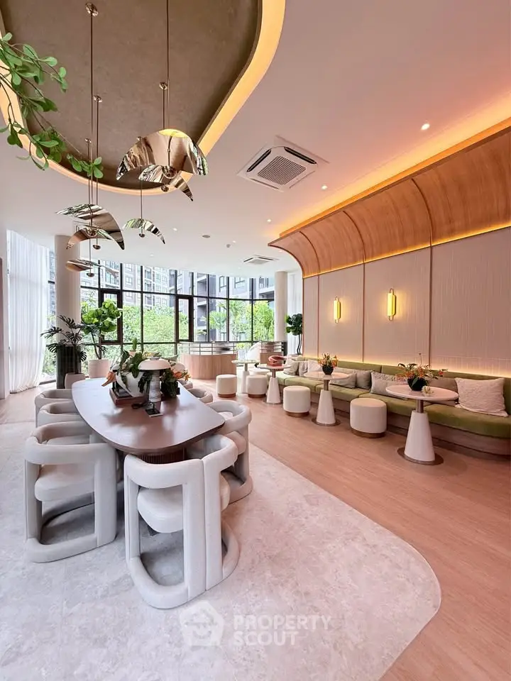 Luxurious modern living room with elegant dining area and stylish decor, featuring large windows and natural light.