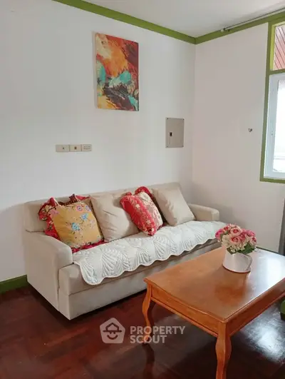 Cozy living room with stylish sofa and vibrant decor accents