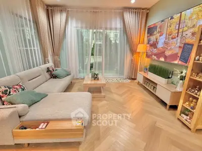 Elegant living room with modern decor and large windows for natural light.
