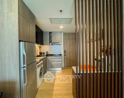 Modern kitchen with sleek wooden cabinetry and built-in appliances