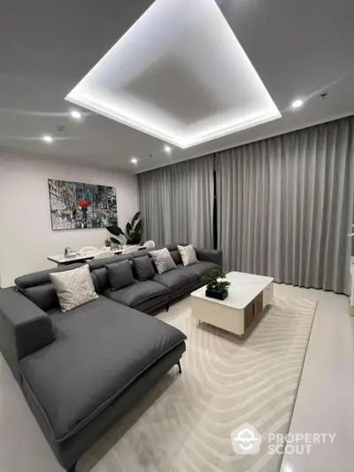 Modern living room with stylish gray sofa and elegant decor