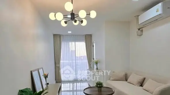 Bright and modern living room with elegant lighting and cozy sofa.