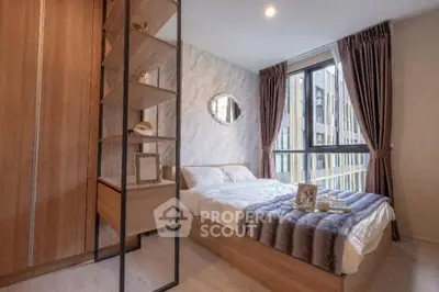 Modern bedroom with stylish decor and large window offering city view