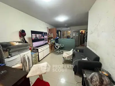 Cozy living room with modern decor and entertainment setup, perfect for relaxation and leisure.