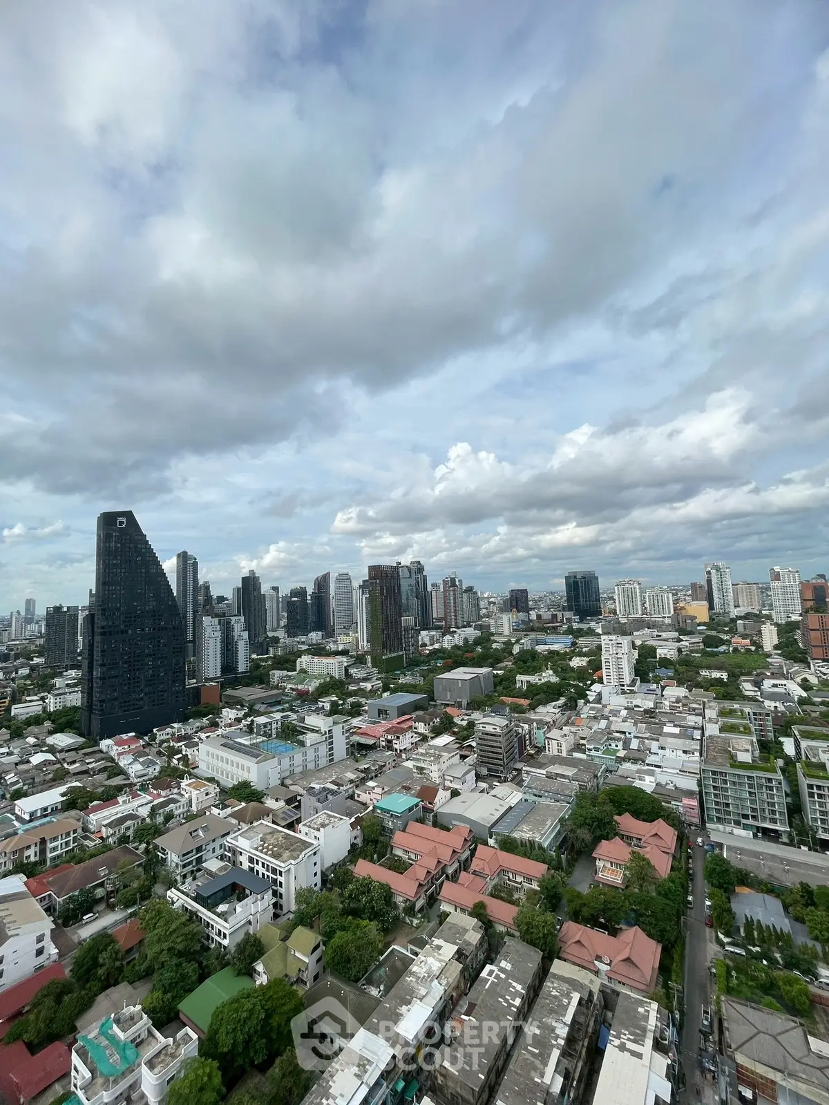 Stunning cityscape view showcasing modern skyline and lush greenery, perfect for urban living enthusiasts.