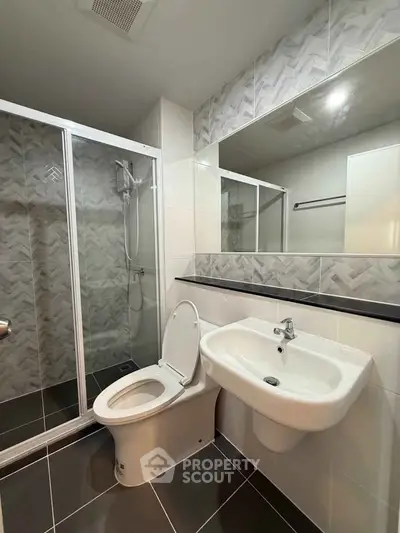 Modern bathroom with sleek shower and stylish tile design