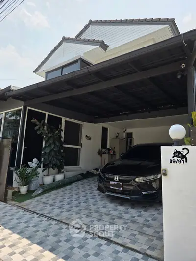Modern house with covered carport and stylish exterior design.