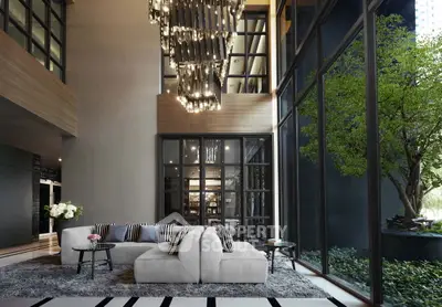 Luxurious modern living room with floor-to-ceiling windows and elegant chandelier.
